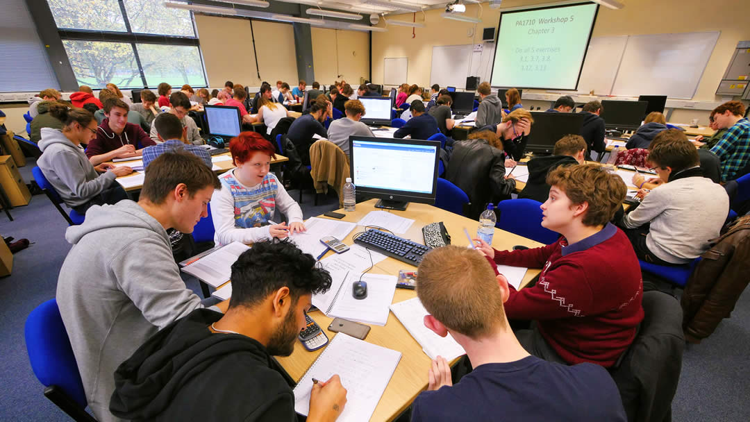 Students working inside the Physics and Astronomy Building