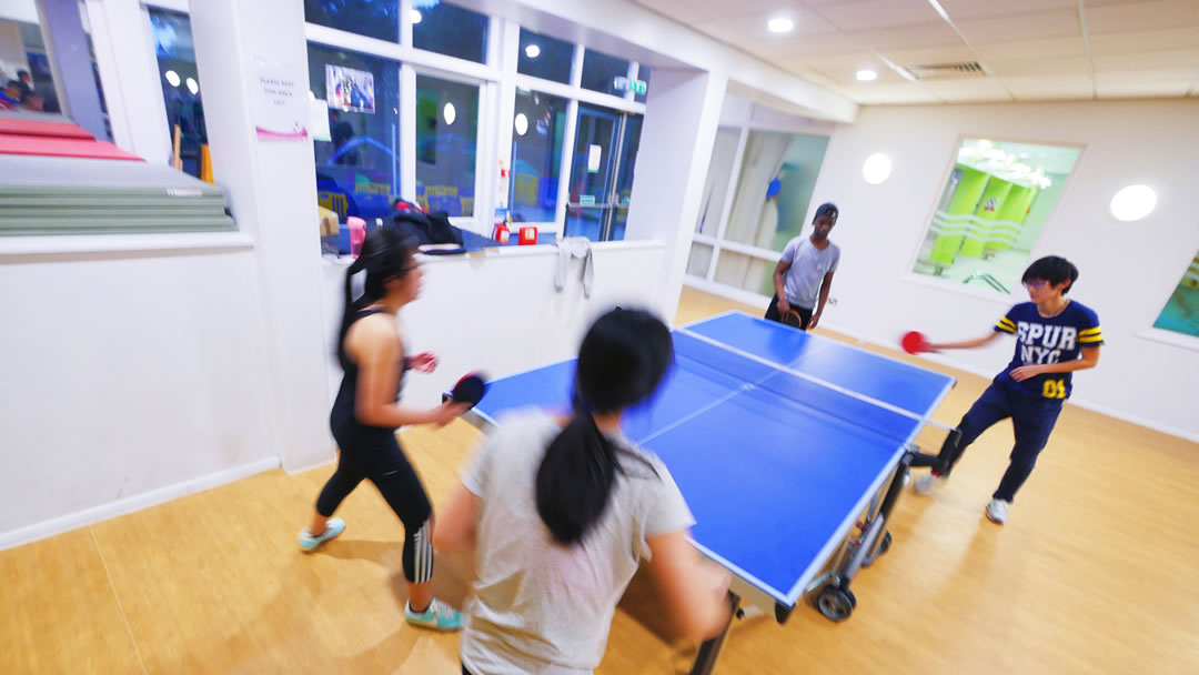 Students playing table tennis