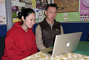 Picture of Jocelin and Thomas with laptop computer