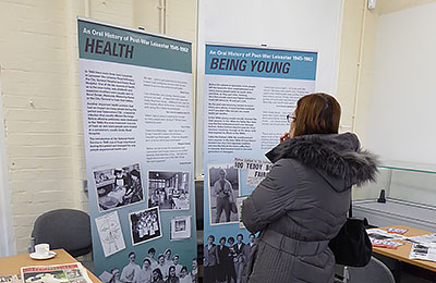 Photo of woman looking at banners.